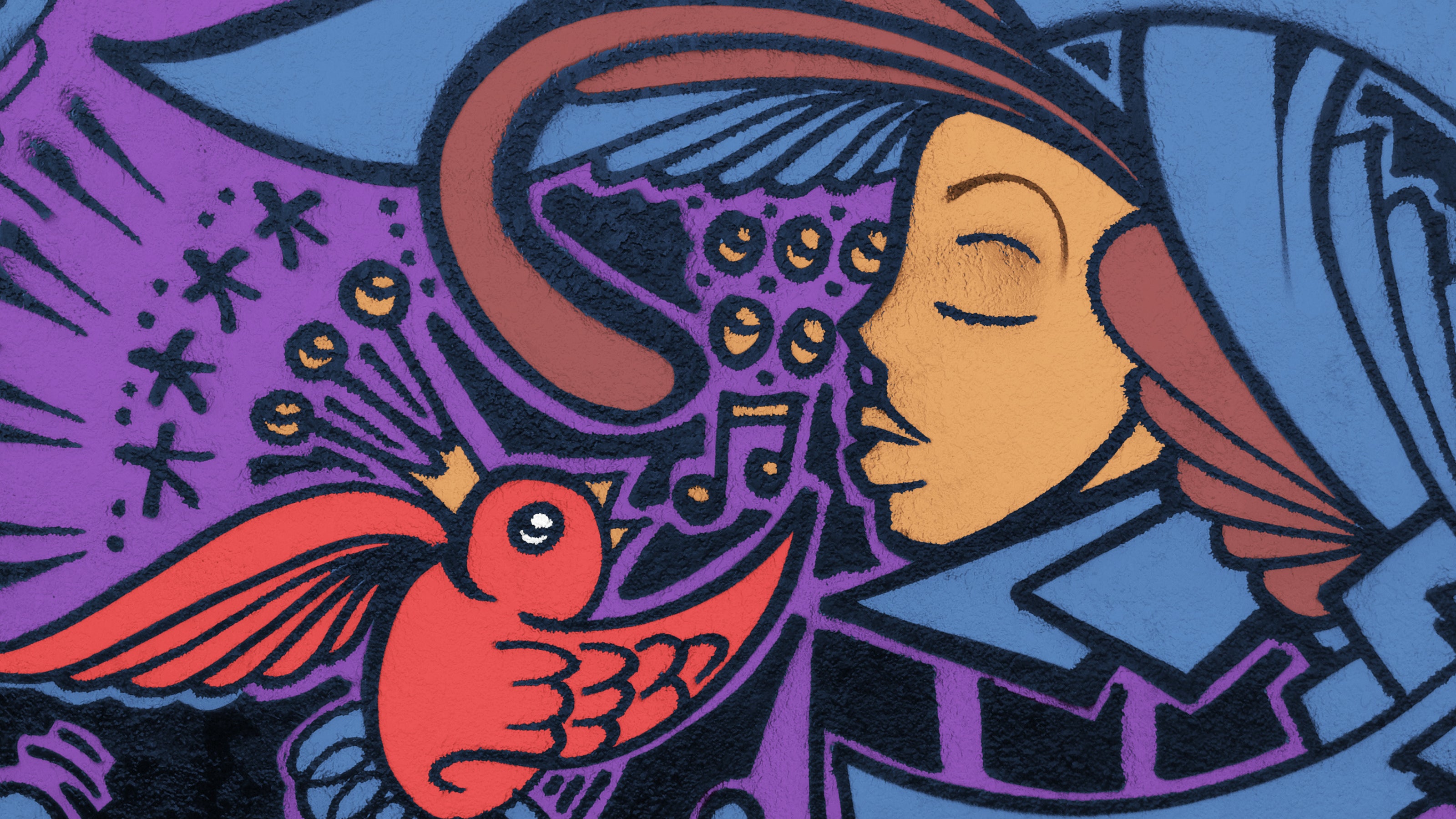 A vibrant street mural of a bright red songbird singing to a Latino woman in armor.